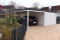 Einzel-Garage aus Stahl mit Schwingtor + Anbau-Carport links daneben - BRANDL