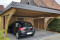 Doppel-Carport aus Holz mit Bogenpfosten beidseitig + Abstellkammer (Geräteraum, Schuppen) hinten integriert - BRANDL